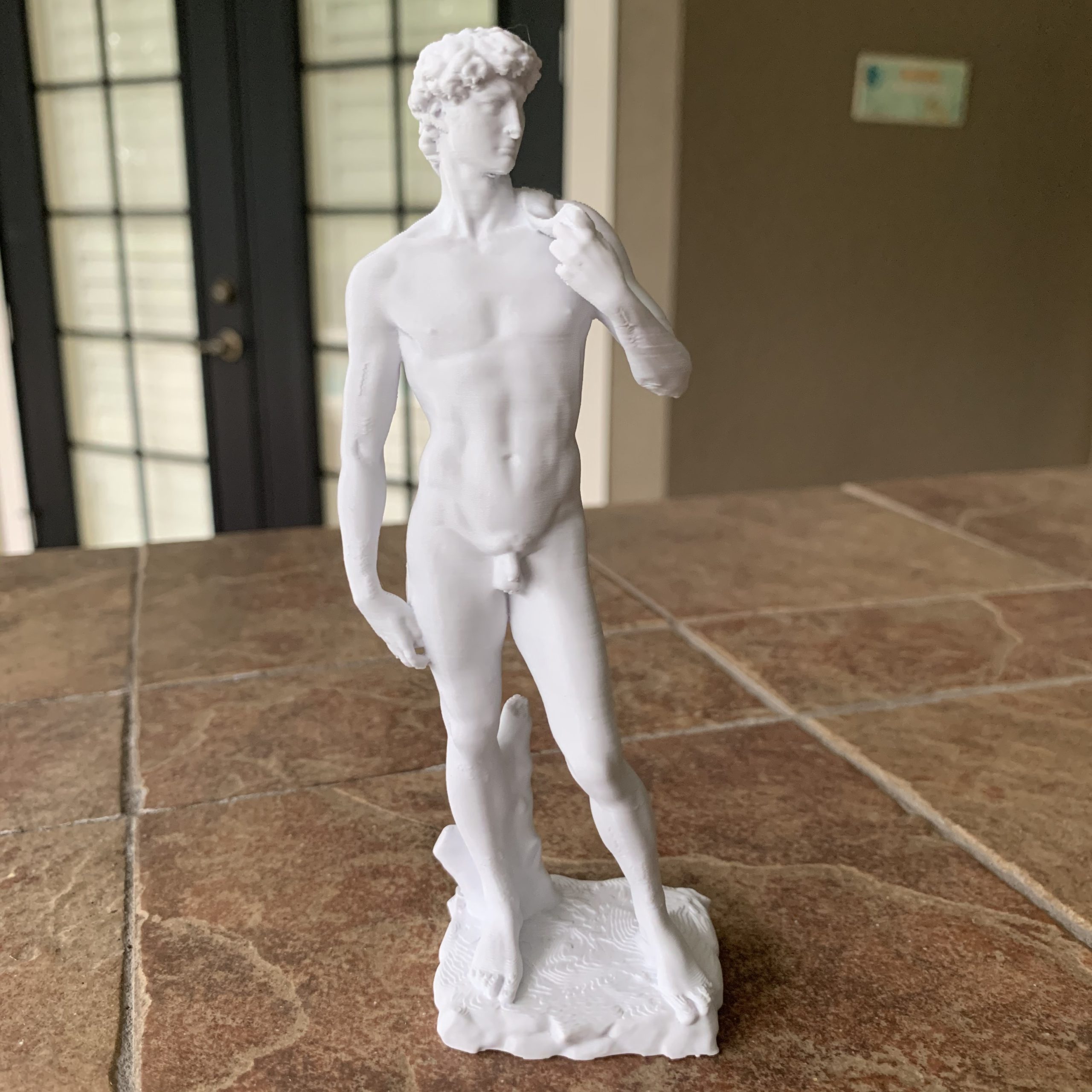 White 3D-printed statue of Michelangelo’s David