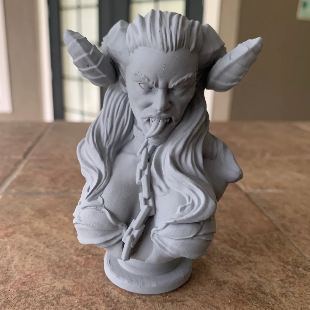 Sinister succubus bust with horns and long hair, primed gray