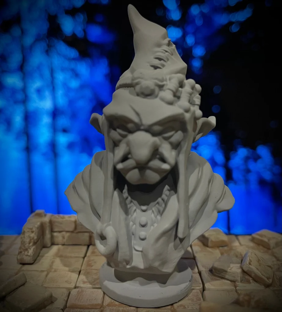 Goblin wizard bust in a pointed hat, primed gray