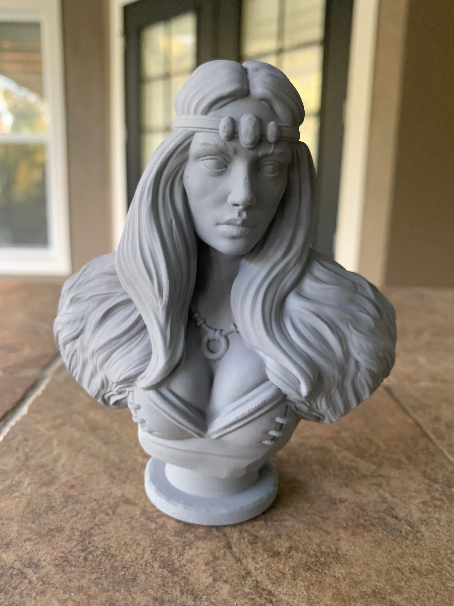 Celtic princess bust with long flowing hair and a circlet, primed gray