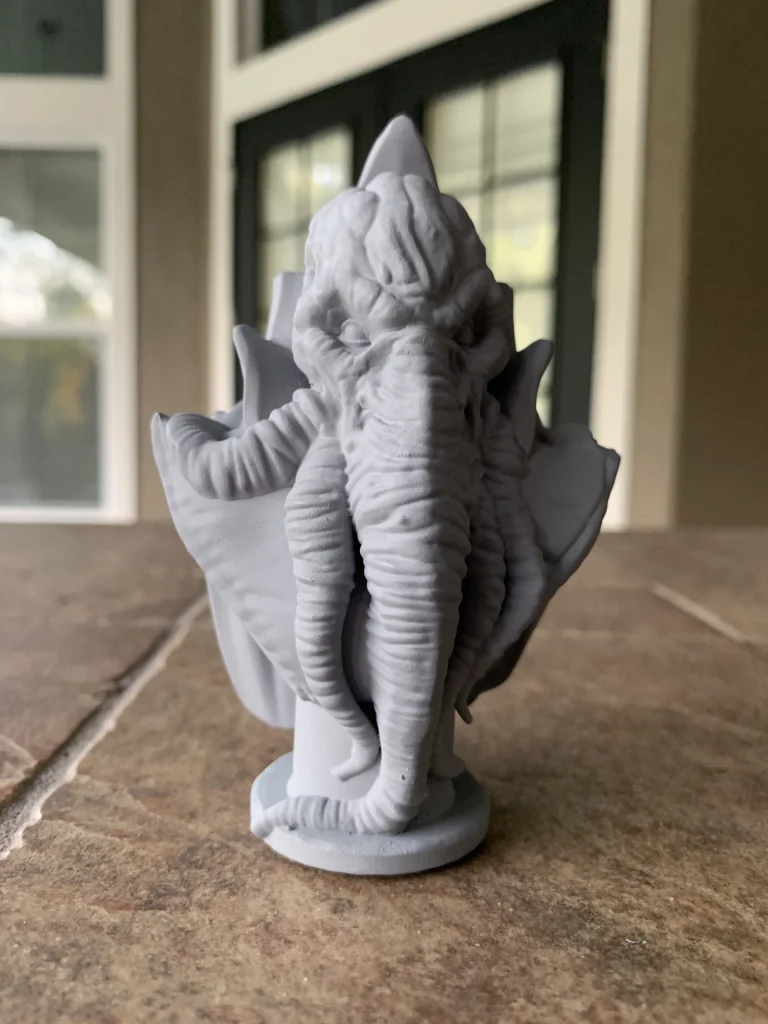 Mind flayer bust with a tentacled face and high collar, primed gray