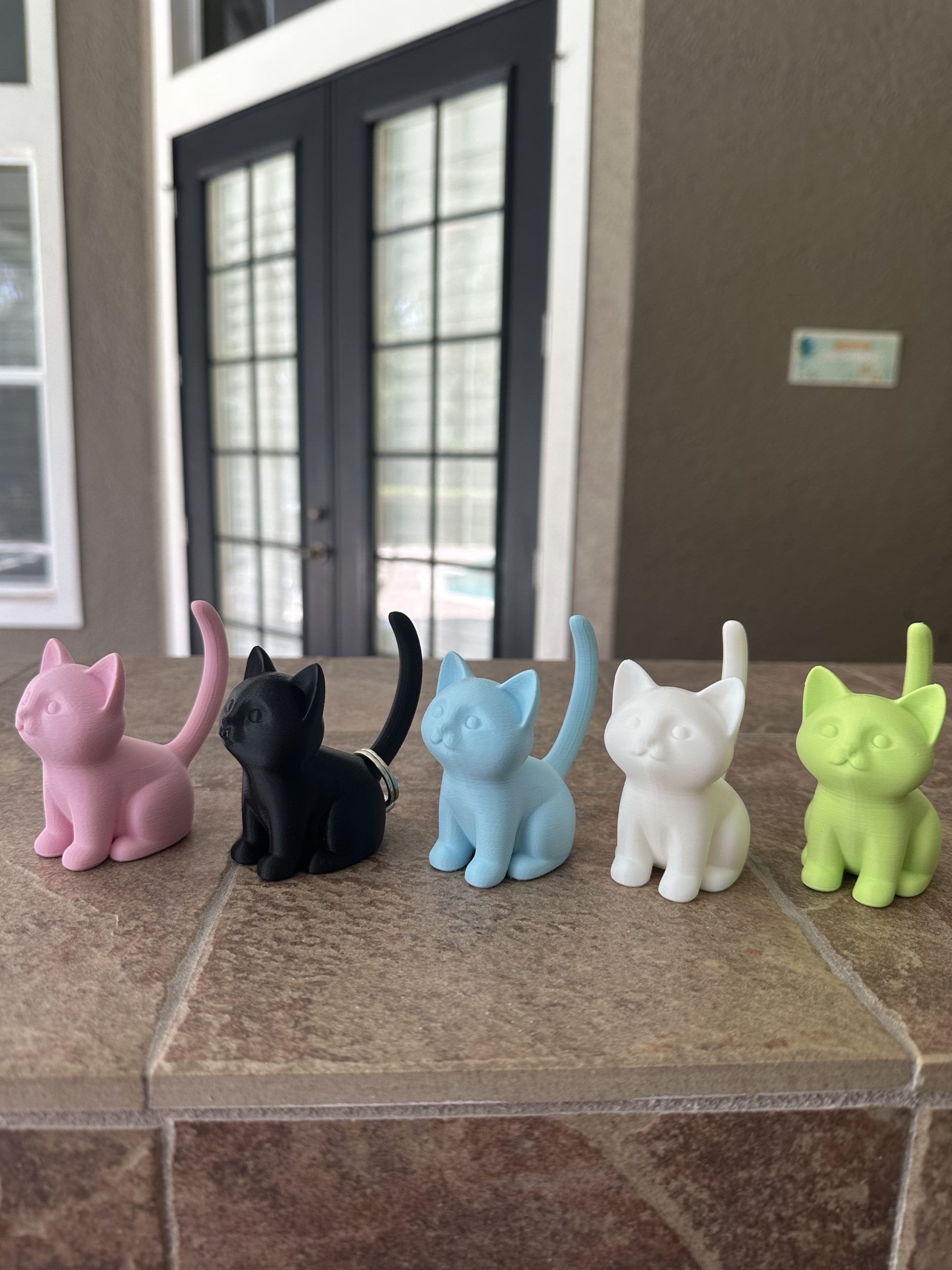 Cat ring holders in light pink, black, light blue, white and light green