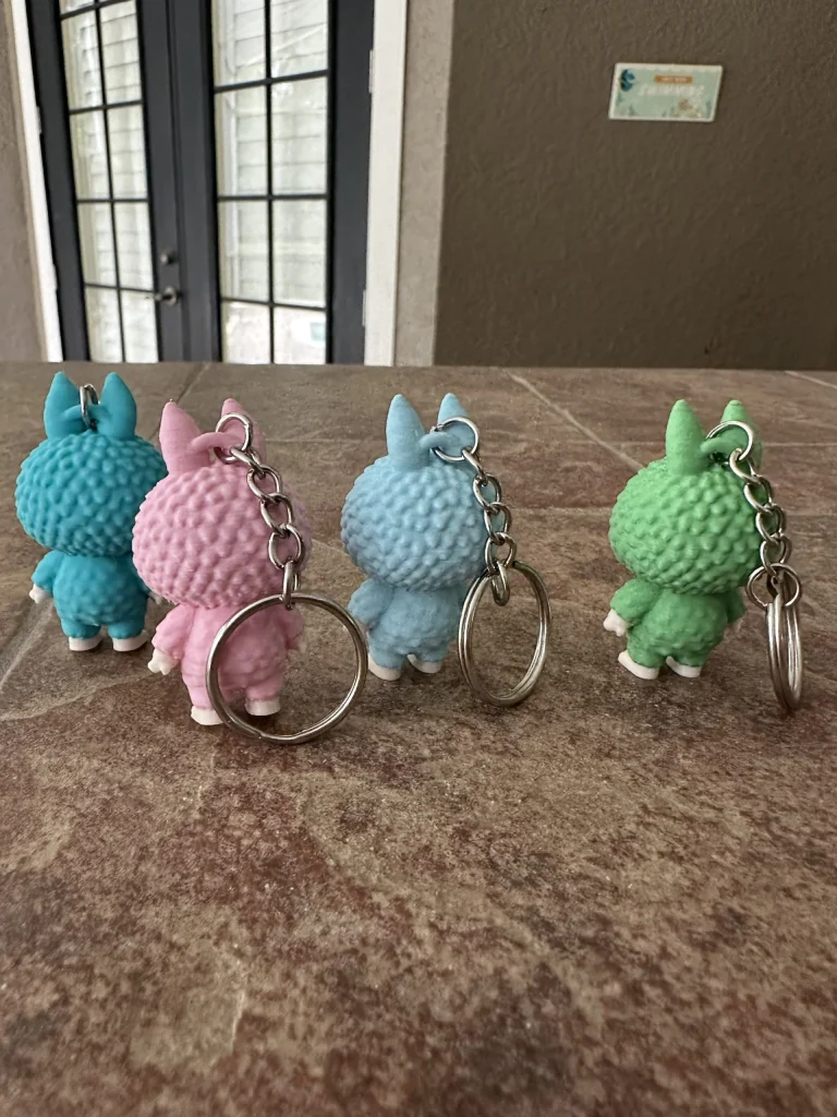 Doll keychains in four colors