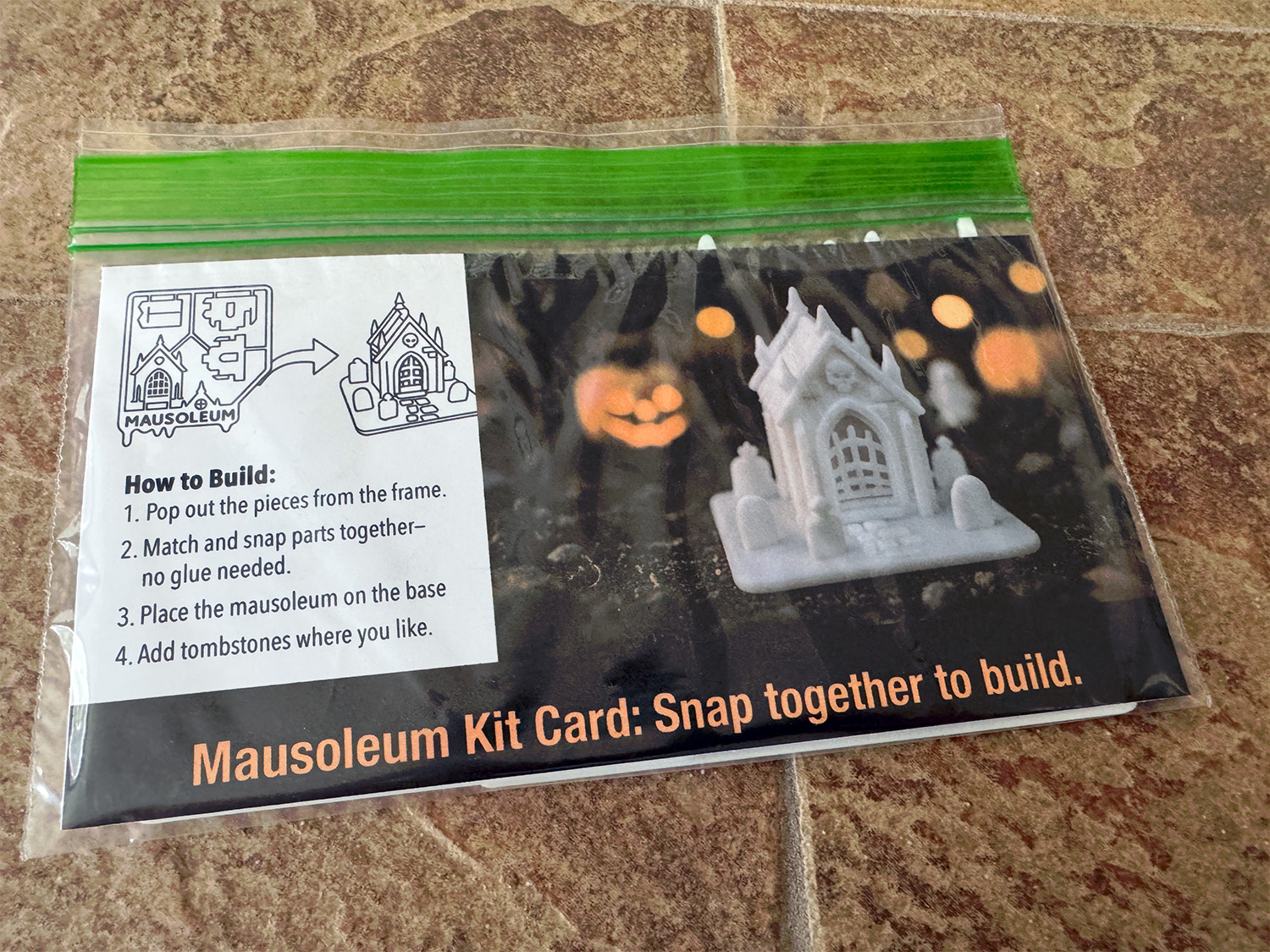 Mausoleum kit card in its package, with build instructions